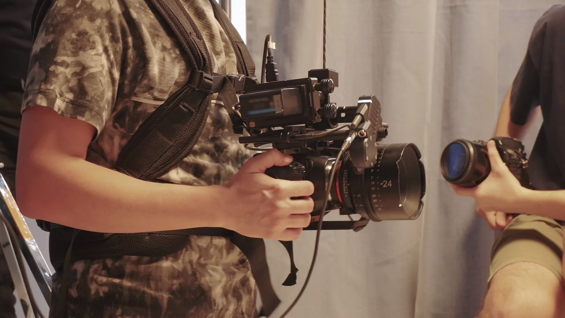 Videographer operating a cinema camera